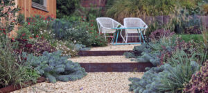 corten and gravel steps garden chairs textural planting drought tolerant planting gravel path year round interest brighton planting design